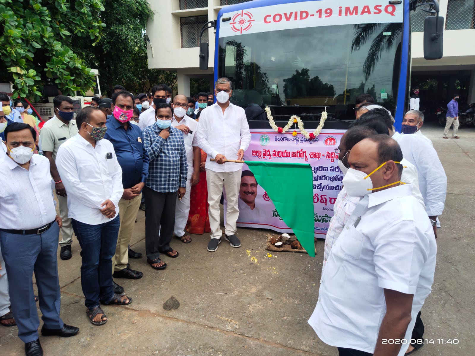Inauguration of COVID-19 iMASQ bus at Siddipet by T. Harish Rao, Telangana Minister, with green flag · banner Telangana State Government District Medical and Health Department Siddipet · 14 August 2020