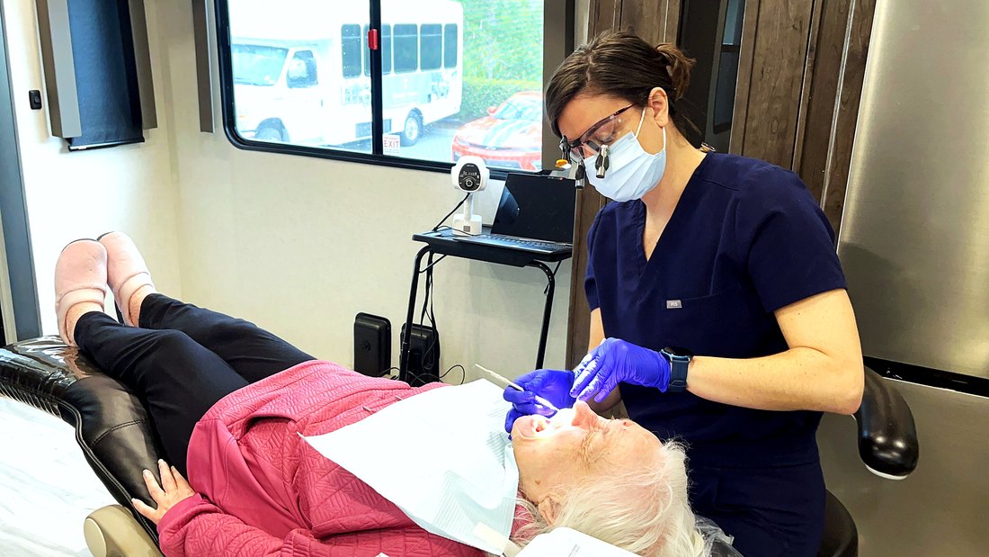Clinician and resident inside the Vera Dental Profiling Camps operatory