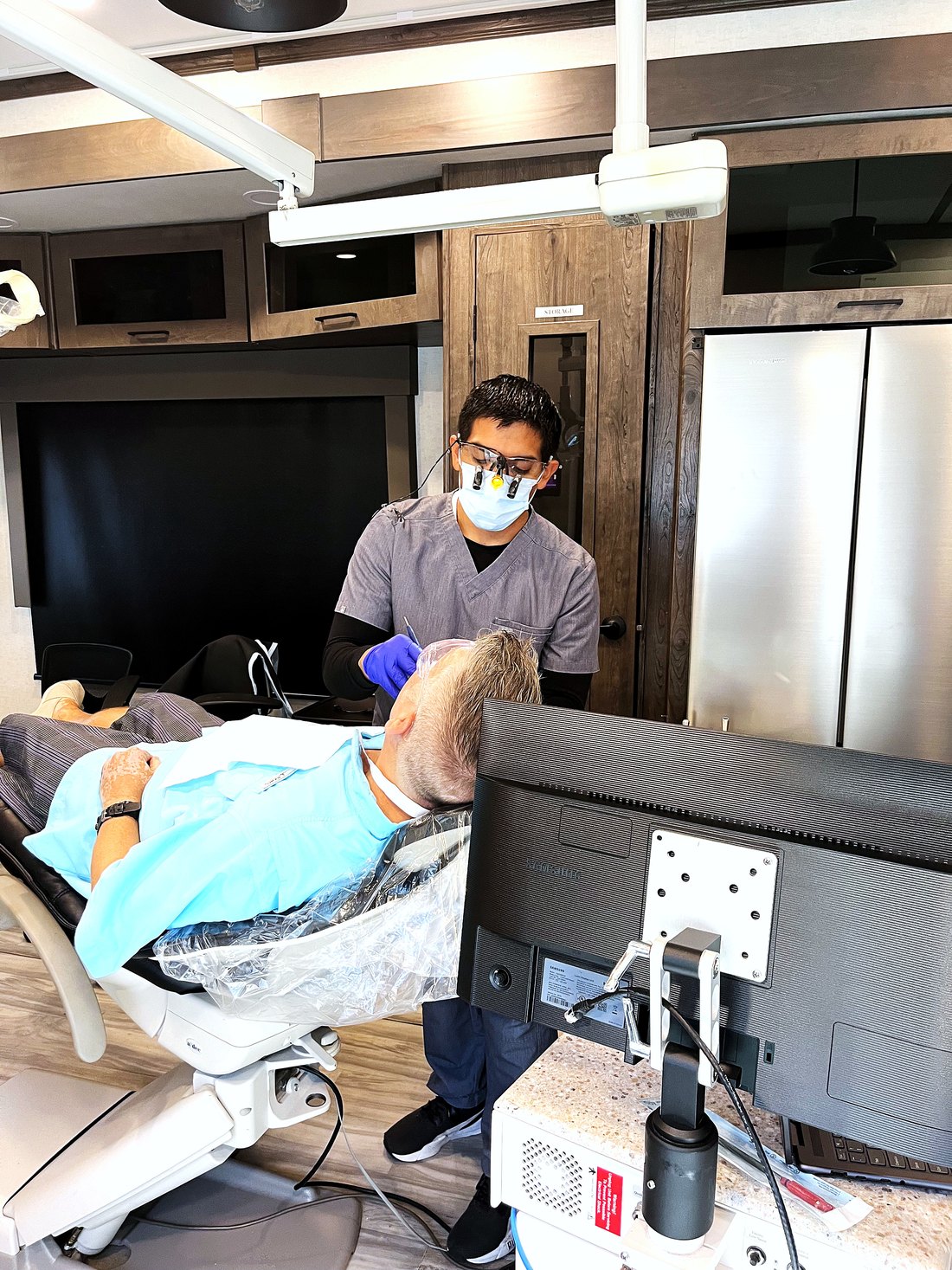 Clinician treating a resident on-site