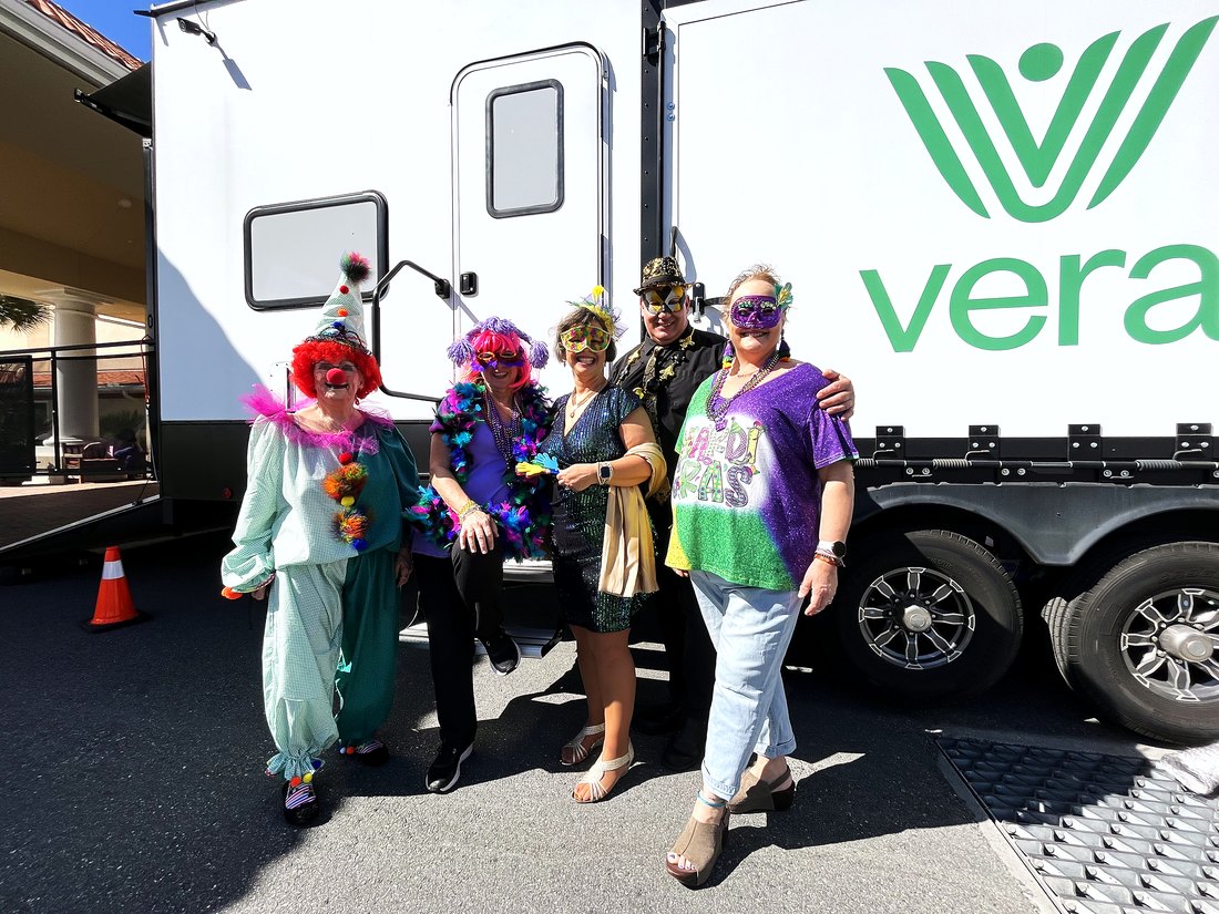 Residents and the Vera team together at a camp